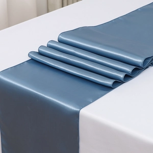 Detailed macro view of the blue satin table runner with a smooth glossy texture finish