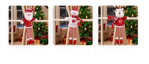 Close-up of knitted Santa, Snowman, and Reindeer dolls for Christmas curtain tiebacks