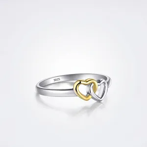Sweet S925 sterling silver hollow heart ring with two-tone gold plated finish for women