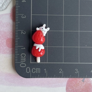 Miniature resin strawberry rabbit charm shown with ruler scale for 3.5cm size detail