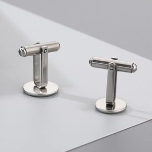 Close-up of polished stainless steel blank cufflinks with round base and T-bar swivel