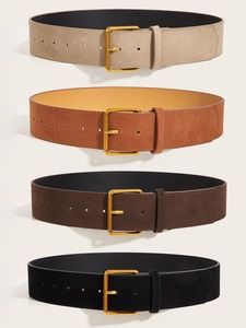 Close-up of four colors of suede waist belts with square golden metal buckles