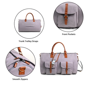 Détails du sac à vêtements gris avec sangle de trolley, poches avant et fermetures éclair fluides