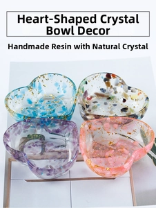 Detail view of heart-shaped resin bowls with natural crystal chips and gold flakes