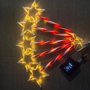 Solar LED Christmas star lights with red and white candy cane poles and smart control box