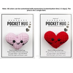 Detail of handmade pink and red crocheted hearts on Pocket Hug gift cards with poems