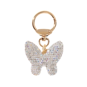 Close-up of a sparkling gold butterfly keychain with crystal rhinestones on a hook
