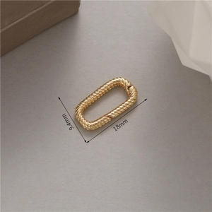 Macro view of 18mm 14k gold-plated twisted oval connector with size measurements