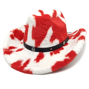 Detail of cow print cowboy hat with plush faux fur texture and black leather band