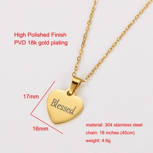 Macro detail of a 18k gold plated heart pendant featuring a Blessed engraving