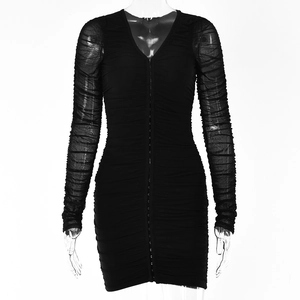 Detailed close-up of ruched fabric and front hook-and-eye closure on a black V-neck mini dress