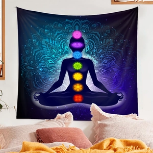 Detail of yoga meditation tapestry with seven chakras and blue mandala pattern on bedroom wall