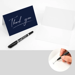 6-piece navy blue thank you card set with white envelopes and a black marker pen