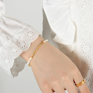 French chic gold chain bracelet with freshwater pearls and wavy geometric ring set