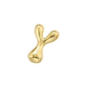 Macro shot of liquid-style golden letter Y pendant with polished metallic finish