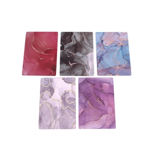 Macro shot of marble texture earring display cards in multiple colors with gold accents