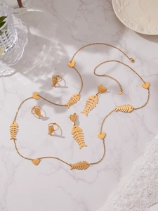 Detailed set of gold plated stainless steel jewelry with fishbone and heart charms