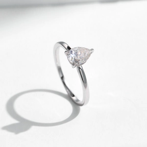 Elegant s925 silver ring featuring a 0.8ct pear-cut moissanite stone in a minimalist design
