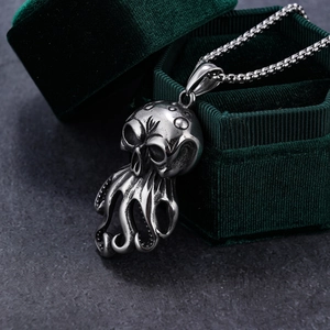 Silver octopus skull pendant necklace with box chain in a green velvet jewelry box
