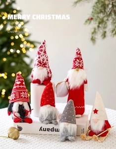 Close-up of 6 handcrafted Christmas gnomes with knit hats and faux fur beards on a table