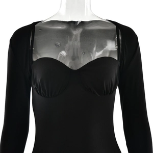 Detail of black long sleeve bustier top with elegant ruffles and slim fit design
