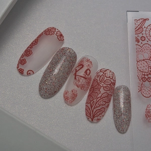 Ultrathin silver glitter and red floral lace nail stickers with 'Ro' monogram art