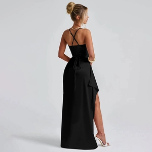 Close-up of elegant crisscross back straps and sexy high slit on black evening dress