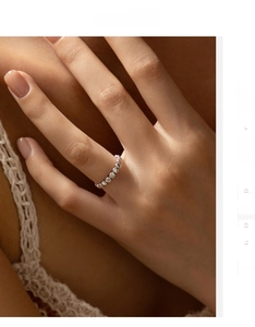 Detail view of a vintage S925 sterling silver beaded ring on a female model finger