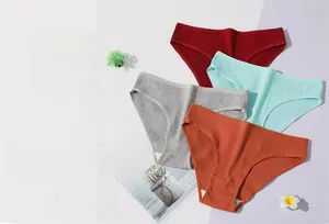 Close-up of seamless cotton ribbed panties in burgundy, blue, grey and orange colors