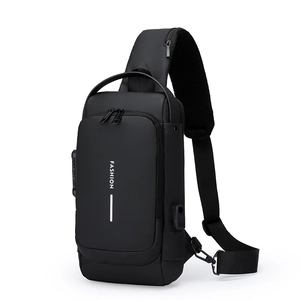 Black sling bag with USB charging port and security lock on a clean white background