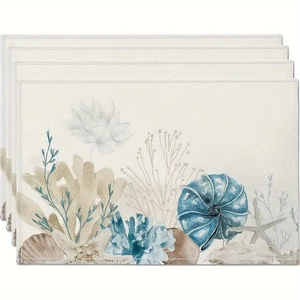 Detailed view of linen texture placemats with blue seashell and coral watercolor patterns