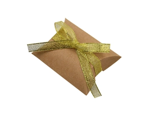 Close-up of brown kraft paper pillow candy box with a decorative gold glitter ribbon bow