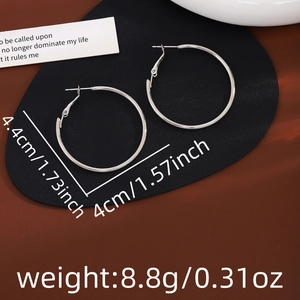 Detail showing 4.4cm silver hoop earrings with measurements and weight specifications