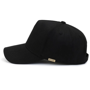 Classic black cotton baseball cap with gold metal SPORT tag shown from a side profile view