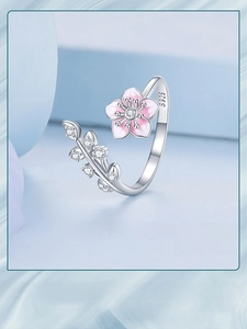 Close-up of S925 sterling silver cherry blossom ring with pink enamel and zircons