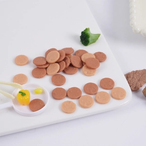 Miniature realistic resin meat patties with vegetable models and tiny white frying pan set
