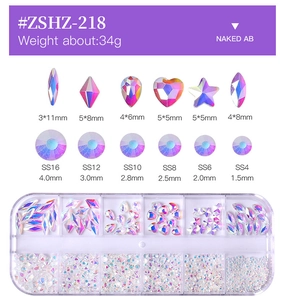 Macro view of 12-grid box with mixed Naked AB crystal rhinestones for nail art decorations