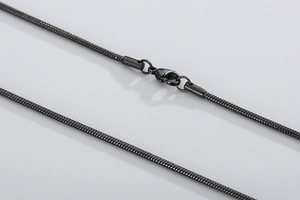 Detailed close-up of a black stainless steel snake chain with a secure lobster clasp