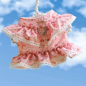Detailed view of pink floral pet harness dress with lace trim and metal D-ring