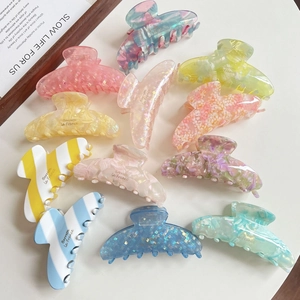 French vintage acetate hair claw clips in checkered and marble patterns for thick hair