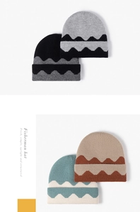 Detail of four color options for winter knit beanies with wavy jacquard pattern and soft texture