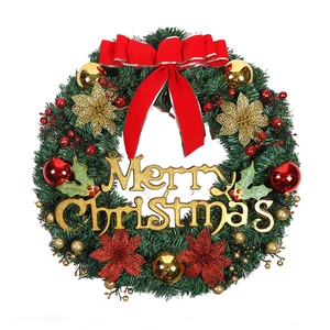Classic Christmas wreath with Merry Christmas sign, red bows, and gold ornaments