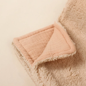 Thick sherpa fleece baby blanket with double-layer muslin cotton trim in cream and pink