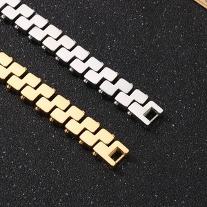 Detail of geometric link bracelets in gold and silver finish with polished steel texture
