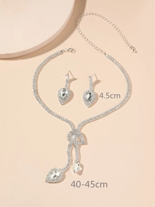 Detailed view of silver-toned rhinestone necklace set with 4.5cm teardrop earrings