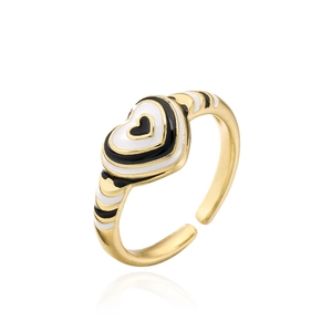 Detail of 18K gold plated heart ring featuring black and white enamel drip oil design