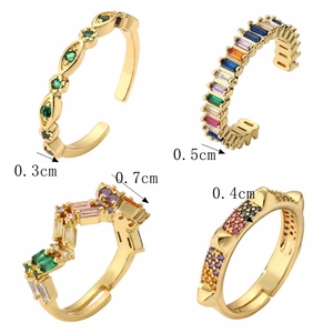 Detailed four-grid view showing gold-plated open rings with colorful zircon inlay sizes