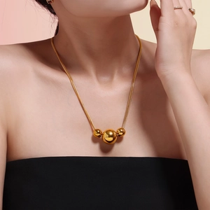 French style double-layered gold snake chain necklace with three spherical pendants