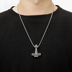 Viking Thor's Hammer necklace in silver and copper finish worn by a male model