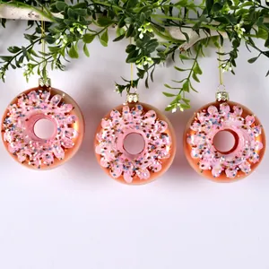 Set of 3 glass painted donut Christmas ornaments with pink frosting on green tree branches
